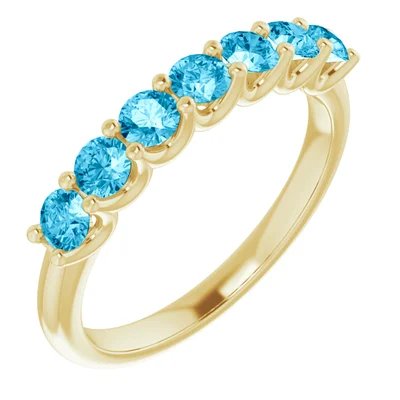 Gold Ring with Seven Light Blue Stones