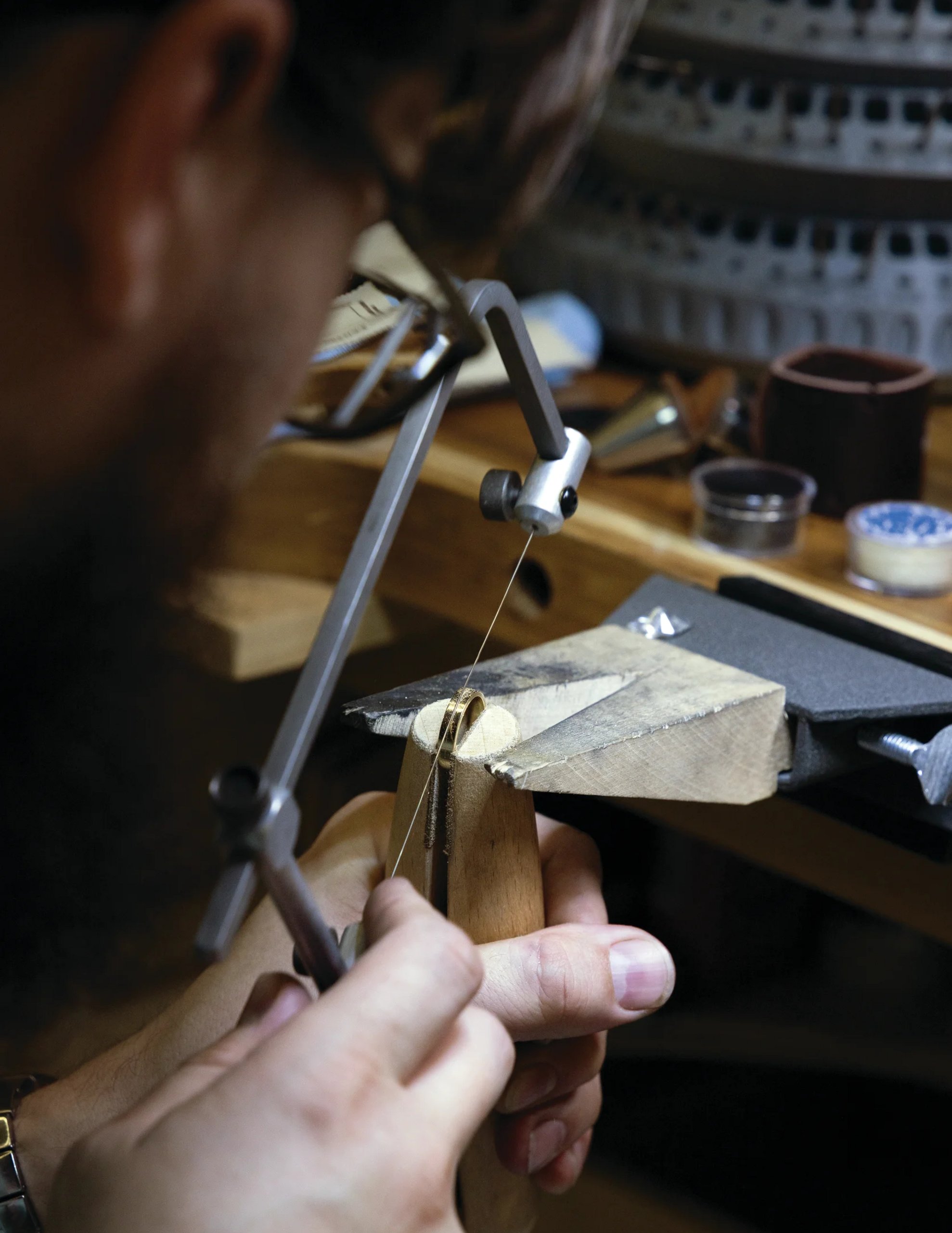 Bench jeweler working with precious metal