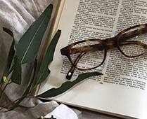 Trendlines Story Inspiration | Tortoiseshell Glasses on open book
